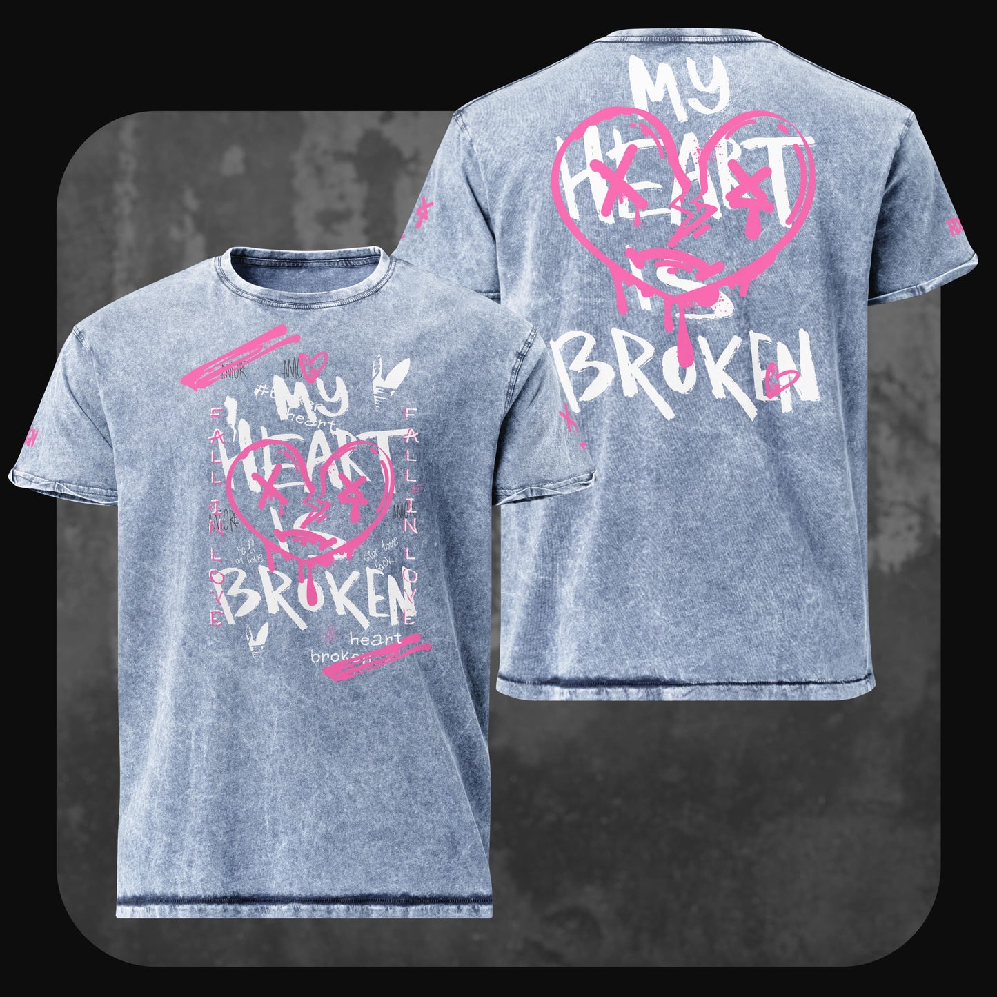 Denim-T-Shirt “My Heart is Broken” von RodneyLogan in ausgewaschenem Blau mit großem pinken Herzprint und weißer Schrift im Graffiti-Stil auf Vorder- und Rückseite.