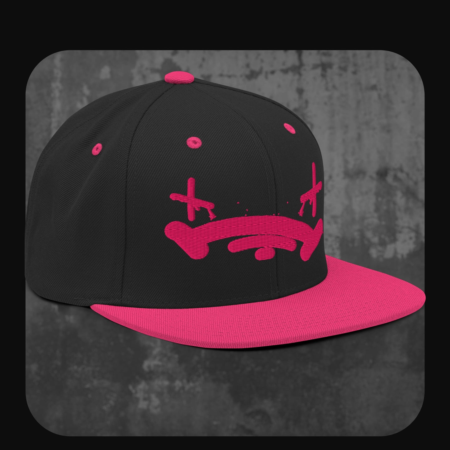 Rodney Logan Snapback Cap „Broken Heart“ mit pinkem Trauergesicht-Stick, schwarzer Krone und pinkem Schirm.