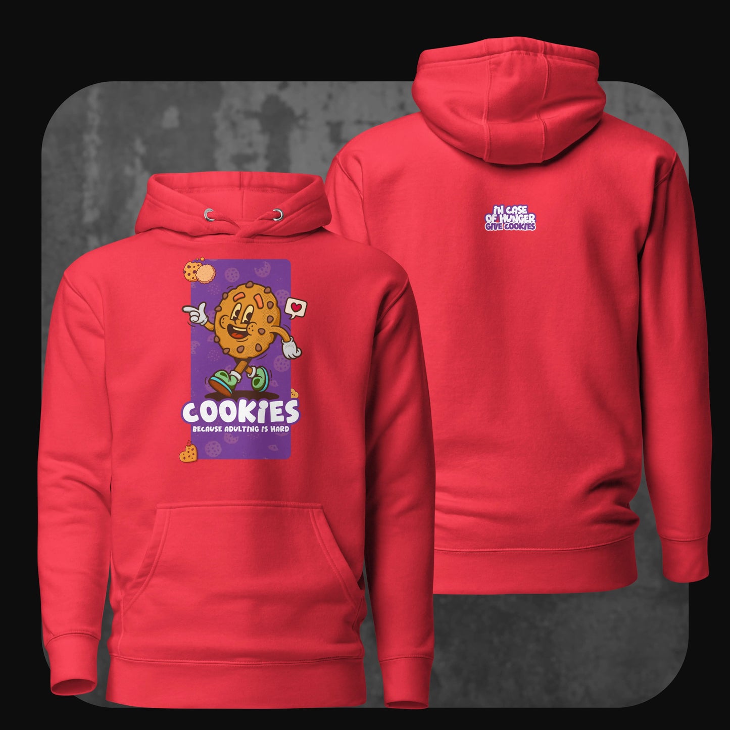 A vibrant red hoodie with a smiling cartoon cookie on the front, captioned “Cookies because adulting is hard.” The back shows the text “In case of hunger, give cookies” in bold purple.