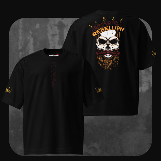 Flat front and back view of the black ‘Crowned Rebellion’ oversized t-shirt. The front includes a vertical ‘REBEL’ text and gold crown sleeve details, while the back showcases a crowned skull illustration with ‘CROWNED REBELLION’ in red and yellow letters.
