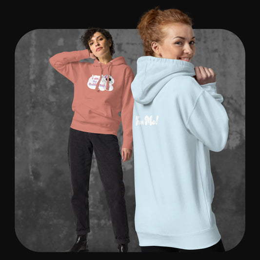 Two models wearing the hoodie in dusty rose and sky blue; one facing forward with the front design, the other turned to show the back “Fear Me!” print.