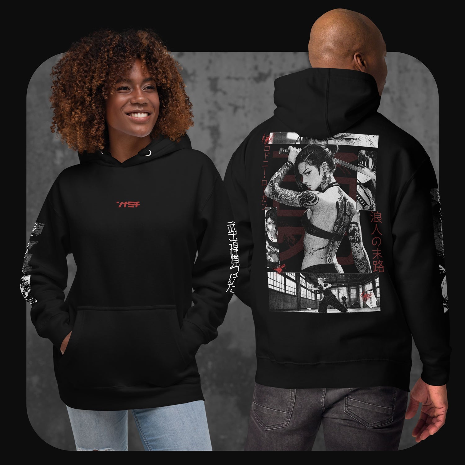 Two models wearing black hoodies with Japanese-inspired artwork. The front features small red katakana text, and the back shows a tattooed woman holding a katana in manga style, surrounded by Japanese characters.