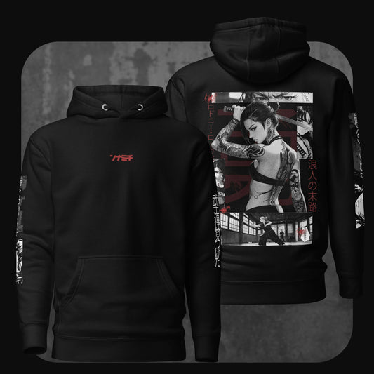Front and back view of a black hoodie. The front features small red katakana text centered on the chest. The back displays a dynamic manga-style illustration of a tattooed female warrior with katana, overlaid with bold red kanji and Japanese text.