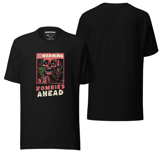 A sleek black T-shirt featuring the text "Zombies Ahead" in bold, attention-grabbing lettering on the front. The dark fabric enhances the graphic's impact, making it ideal for fans of edgy, statement designs